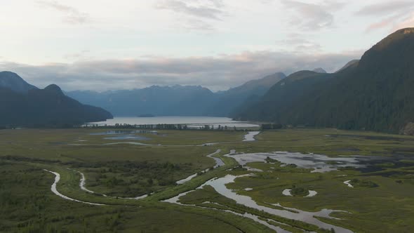 Beautiful Aerial Panoramic View of Canadian Mountain Landscape during a vibrant summer sunset. Taken