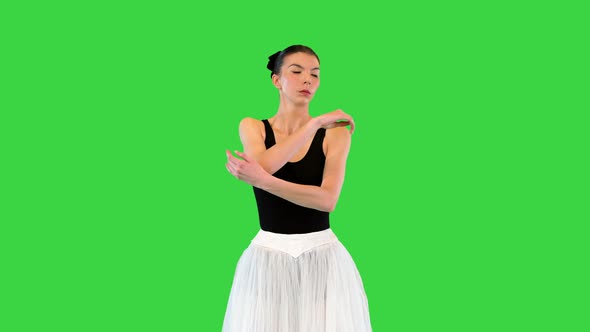 Young Ballerina Warming Up Shoulder Joints on a Green Screen Chroma Key