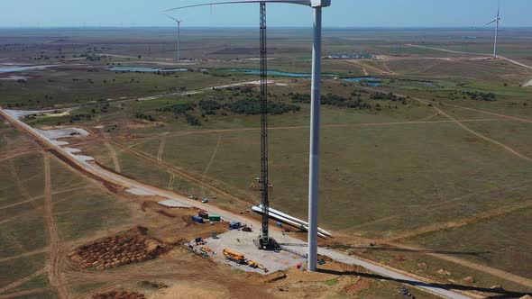 Construction Work on a Huge Wind Turbine, Crane Next To It, Green Energy