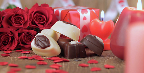 Red Roses and Chocolate Candies with Candles 