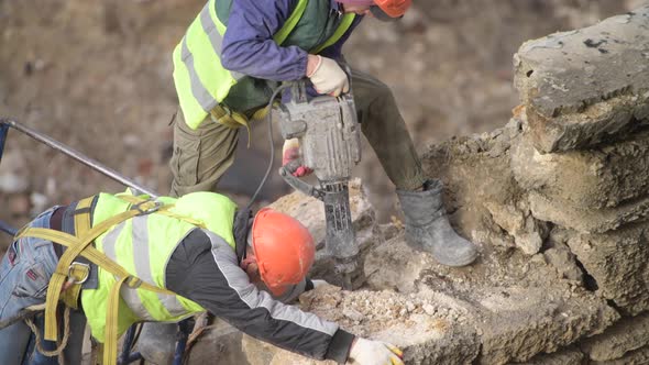 Demolition of Old Abandoned House Workman in Orange Helmet Destroy Wall with Jackhammer