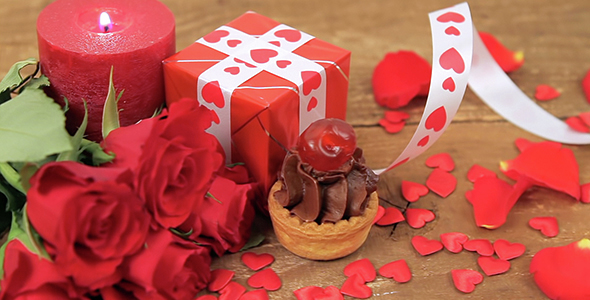 Chocolate Cupcake with Roses and Gift on Wood
