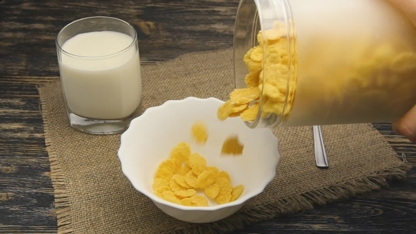 Cornflakes Pouring Into Bowl