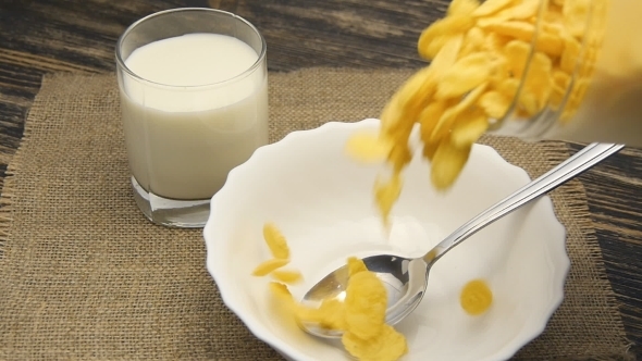 Cornflakes Pouring Into Bowl