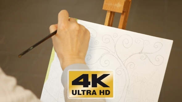 Female Artist Paints Picture Artwork In Art Studio alt