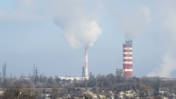 Smoke From Pipes Of The Industrial Plant In The City