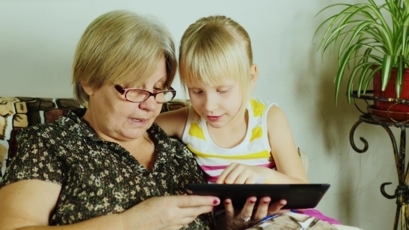 Granddaughter Grandmother Taught To Use Tablet