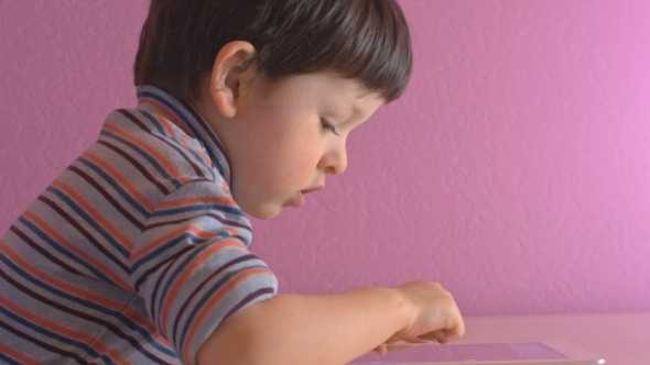 Boy Playing With Digital Tablet