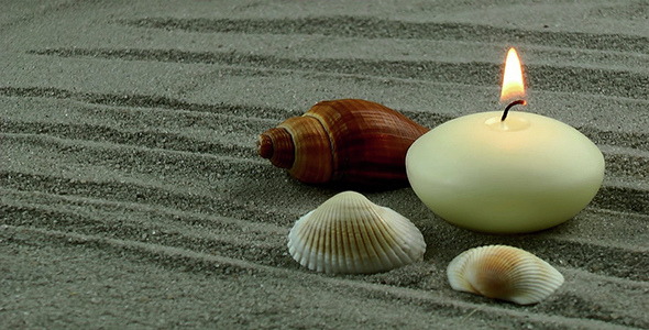 Candle and Seashells on the Sand alt