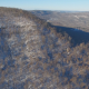Aerial of Light Snow on Hillside - VideoHive Item for Sale