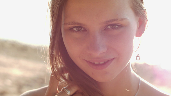 Cute Girl Smiling In Sunny Rays