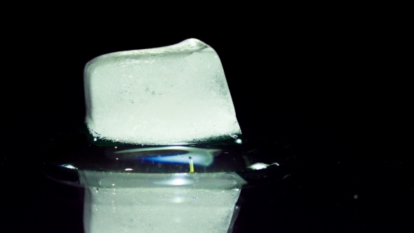 Ice Cube Melting And Moving On a Glass Surface