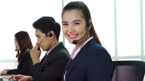 Business People Wearing Headset Working in Office