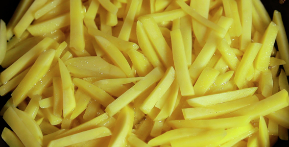 Frying French Fries In Boiling Oil