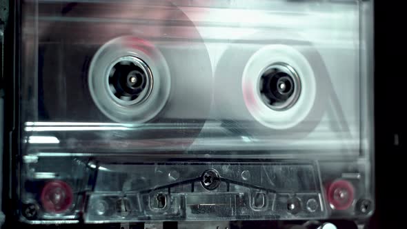 vintage audio cassette fast forwarding and then playback in tape deck