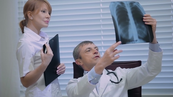 Two Doctors With X-ray Prints alt