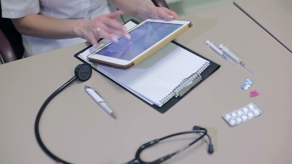 Of a Doctor Is Typing On Digital Tablet alt