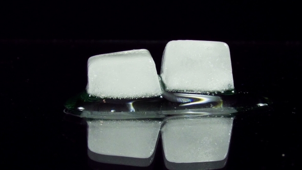 Ice Cube Melting And Moving on A Glass Surface alt