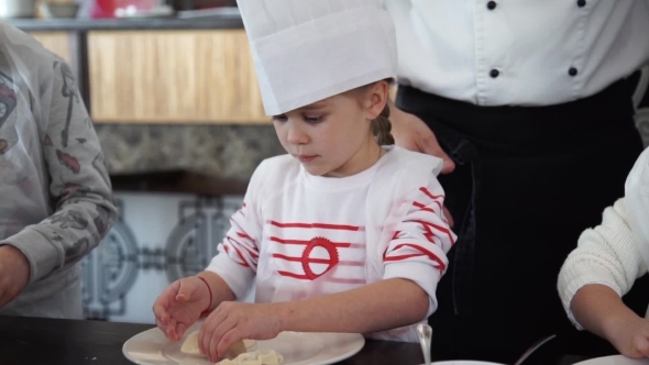 Baby Girl In The Cook Hat