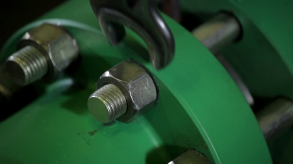 Wrench Tightening Bolt Into Steel Spurt Framework alt