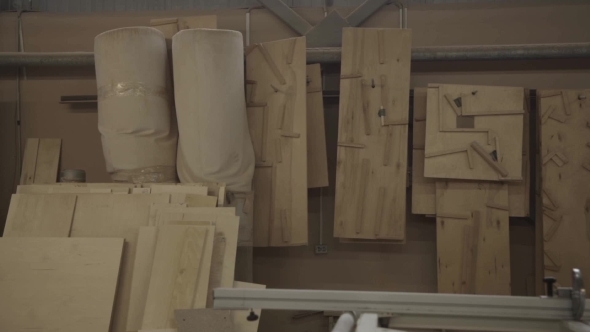 View Of a Wall With Many Wooden Boards In Furniture Factory