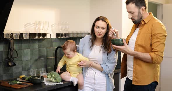 Family with a Baby on the Kitchen