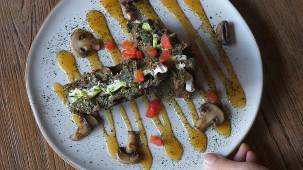 Delicious Vegan Protein Steak Served with Mushrooms in Healthy Dietary Restaurant Alternative Meat