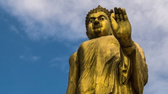 Religious Statue Of Buddha And Blue Sky