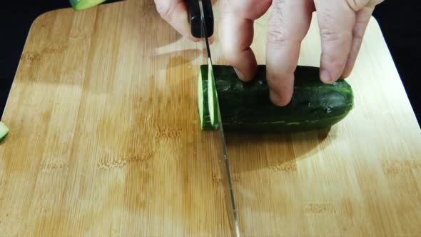 Fresh cucumber on a wooden board