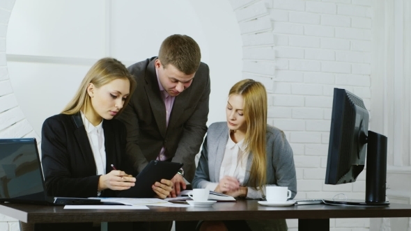 Business Team At Work, On The Background Of The Round Window