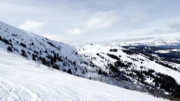 Mountains and Snow Covered Ski Tracks in Alps