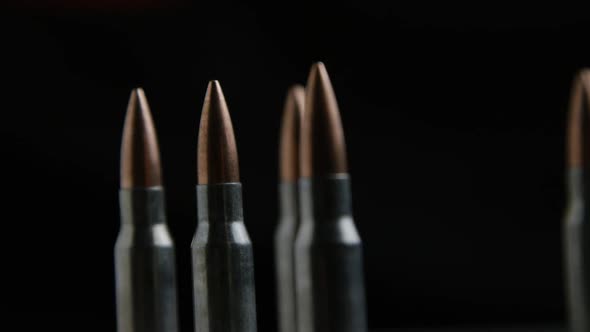 Cinematic rotating shot of bullets on a metallic surface - BULLETS 018