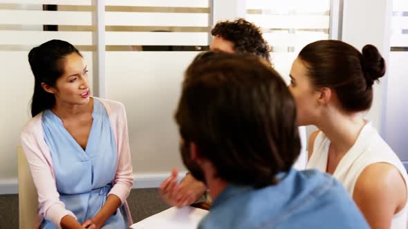 Group of business executives interacting with each other