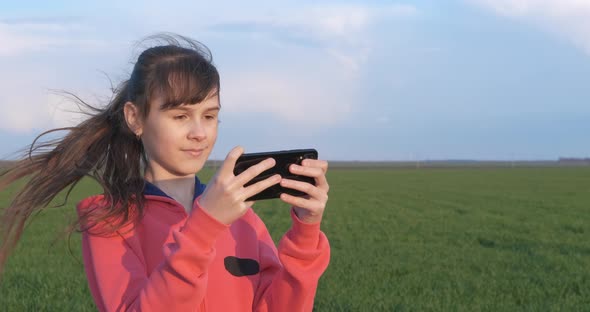 Child Makes Photo in the Field