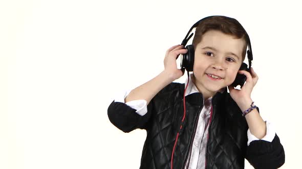 Young Boy Listens Music on Headphones and Dances, Close Ups