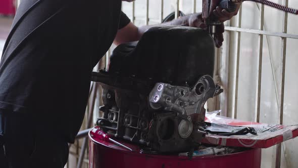 Car Mechanic Repairs Old Car Engine In Workshop 4