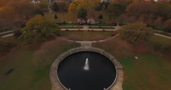 Overhead of elegant pond with fountain in a park