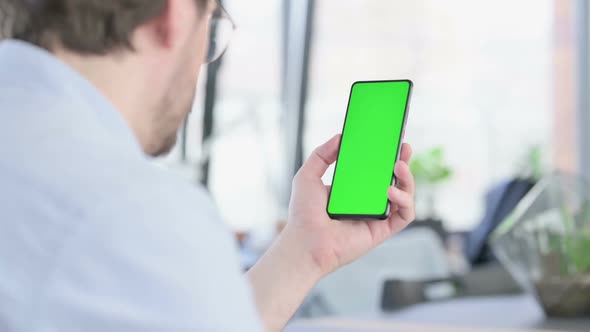 Man in Glasses Using Smartphone with Chroma Screen