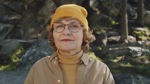 Portrait of Senior Female Tourist in Nature