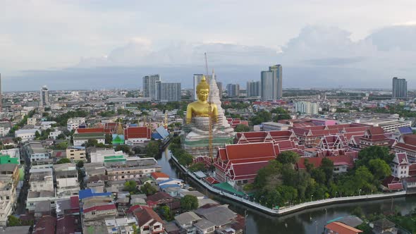 Aerial view of the Giant Golden Buddha in Wat Paknam Phasi Charoen Temple