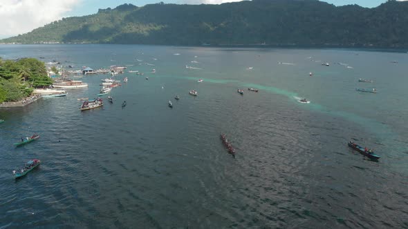 Aerial: kora-kora traditional canoe annual race in the Banda Islands Indonesia