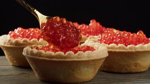 Cooking Tartlets with Red Caviar Closeup