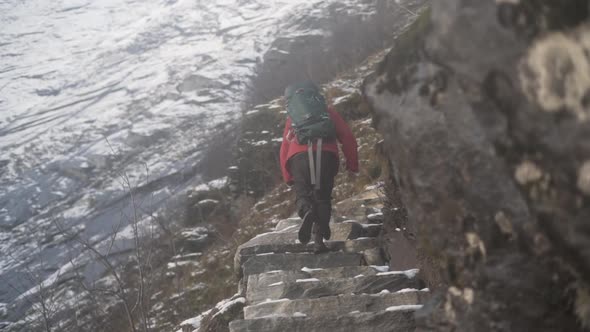 Hiker Walking Up Mountain Steps