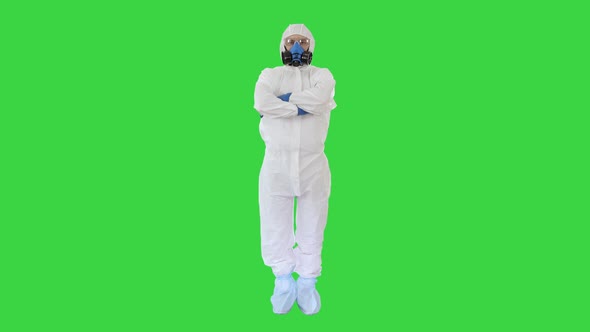 Doctor in Protective Suits with Folded Hands on a Green Screen, Chroma Key.