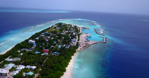 Beautiful birds eye abstract view of a summer white paradise sand beach and aqua blue ocean backgrou