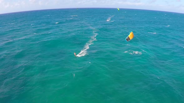 Aerial view of a woman kitesurfing in Hawaii