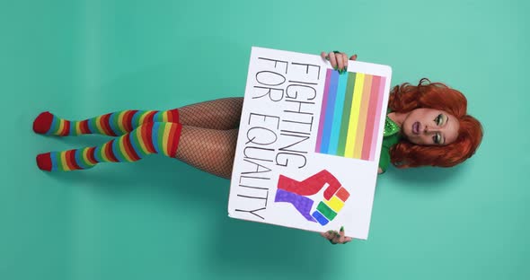 Happy drag queen holding gay pride banner - Lgbtq concept - Vertical video