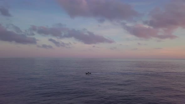 Dinghy Boat at Sea Sunset Aerial View