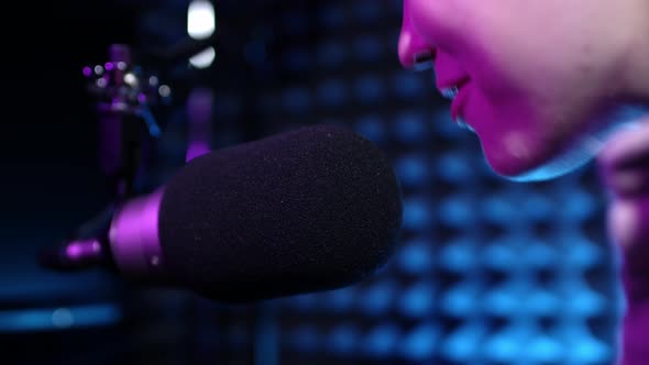 Beautiful Young Girl Dj Speaks Into Microphone Records Podcast or Morning News Show for Radio