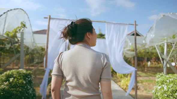 young asian female entrepreneur walking check quality control examine grape farm